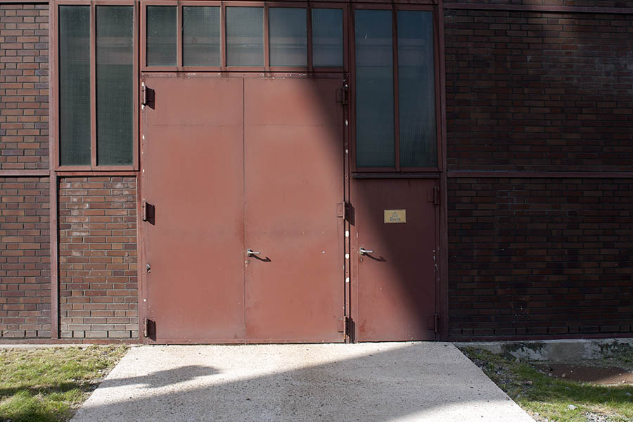 Photo 00048: Facade with red-brown metal gate and door