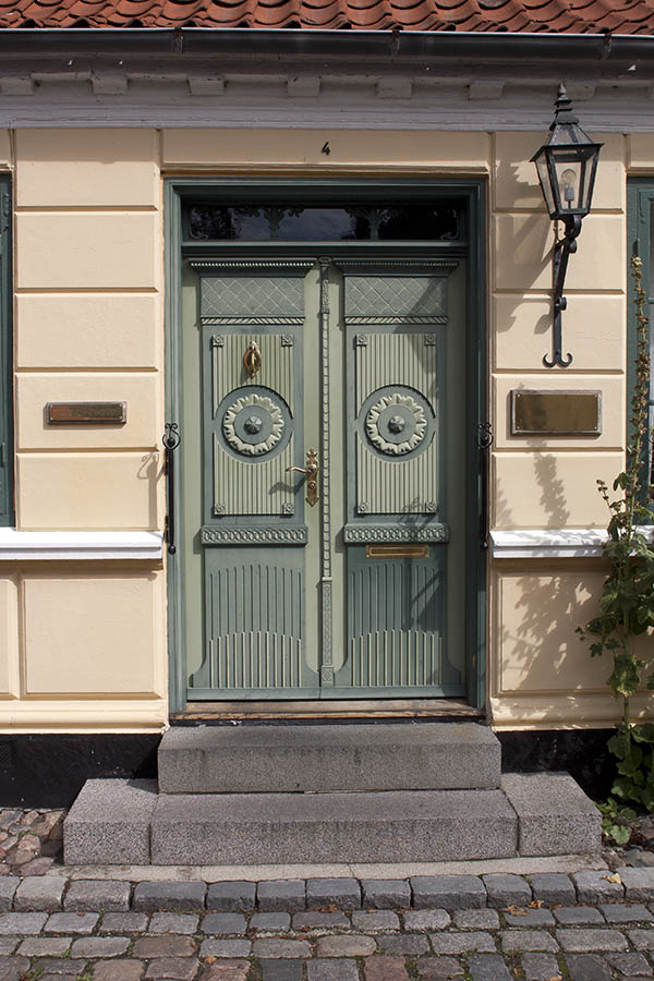 Photo 00449: Panelled, carved, teal and green double door with top window