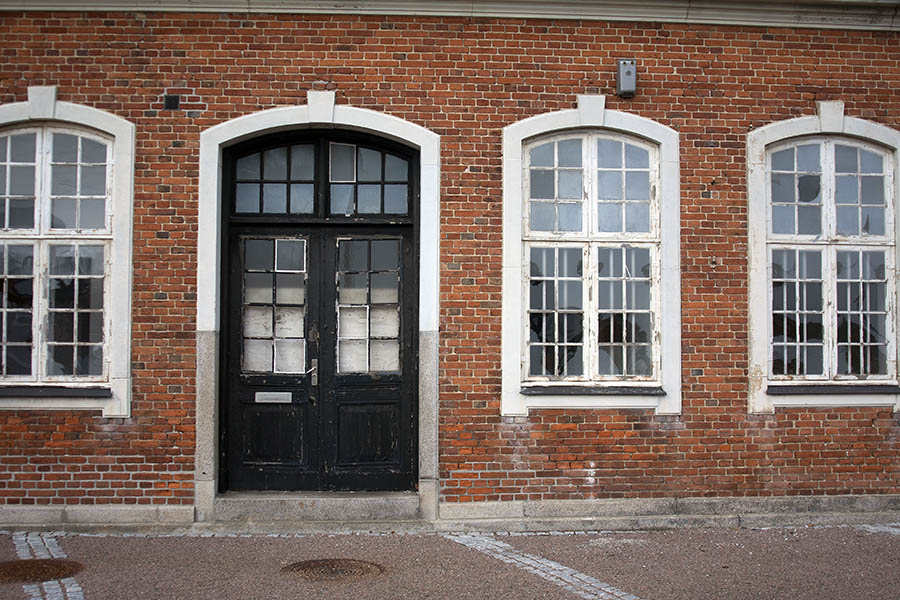 Photo 00774: Worn, formed black double door and windows with pilasters