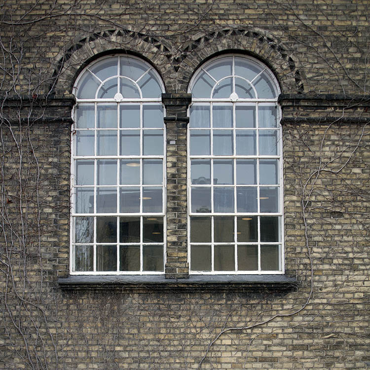 Photo 01411: Two large, formed, metal white windows and 30 panes