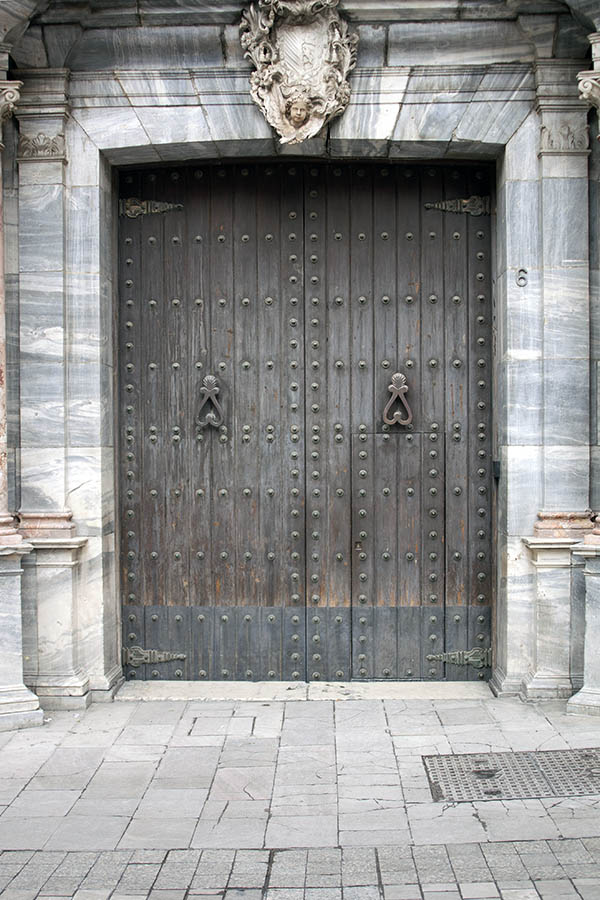 Photo 02615: Formed, oiled gate with minor door inserted and huge, marble pilaster