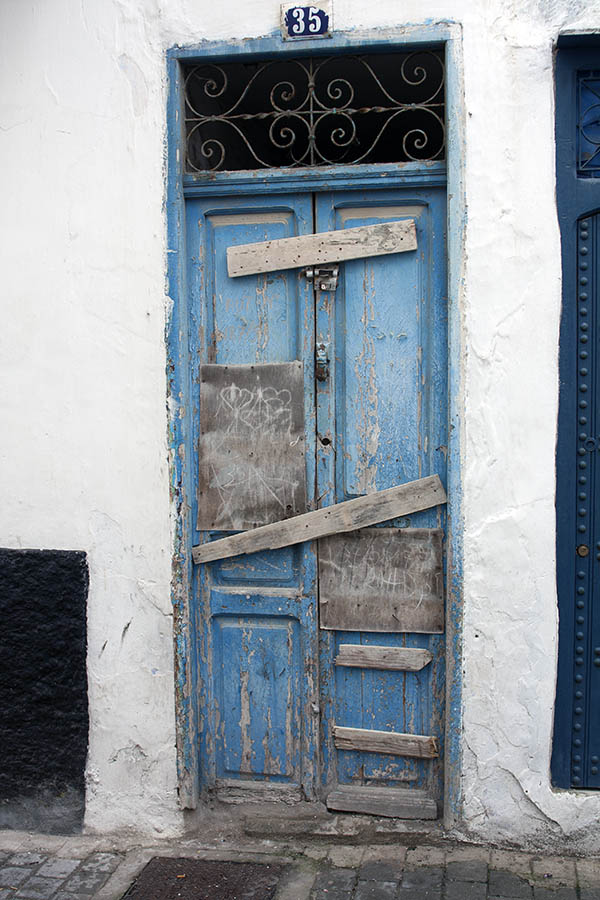 Photo 02733: Decayed, panelled, blocked, light blue double door with top window