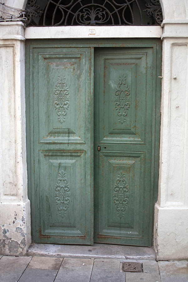 Photo 03119: Panelled, green metal double door in pilasters
