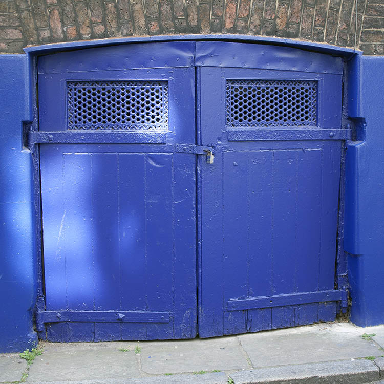 Photo 04441: Formed, blue gate leading to a cellar