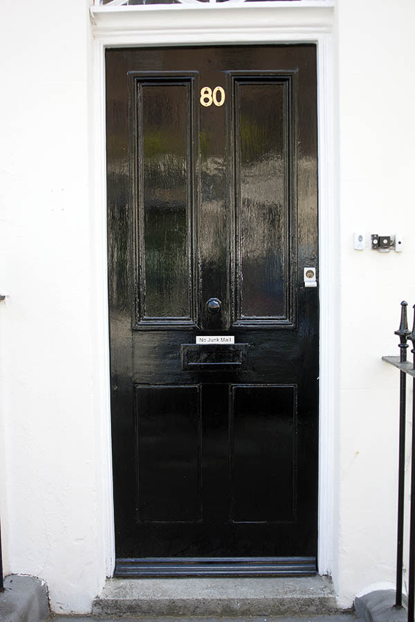Photo 04548: Panelled, shiny, black door