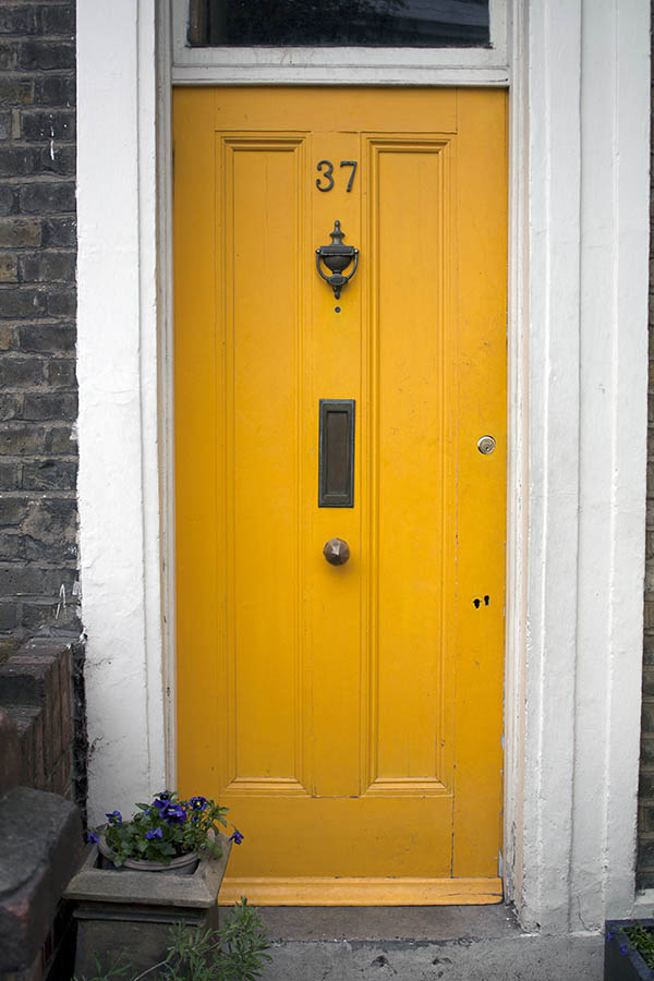 Photo 05028: Panelled, yellow door with top window