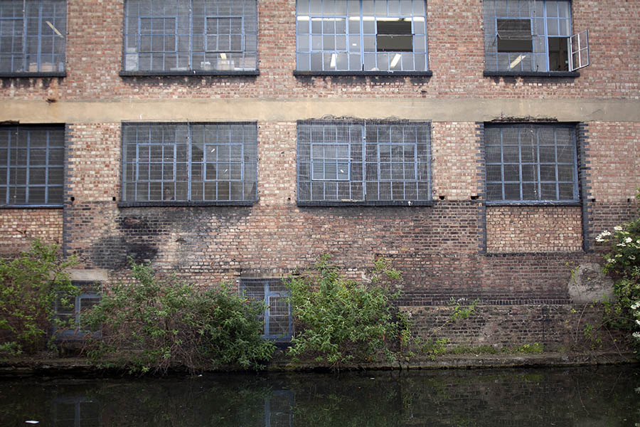 Photo 05040: Factory facade with large, blue, metal windows with lattice