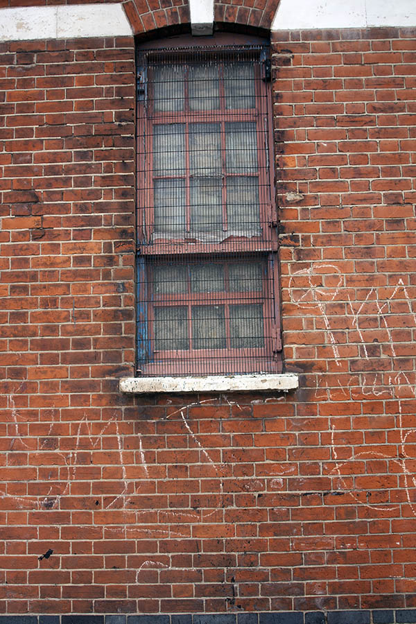 Photo 05111: Large, pale red sash window with lattice