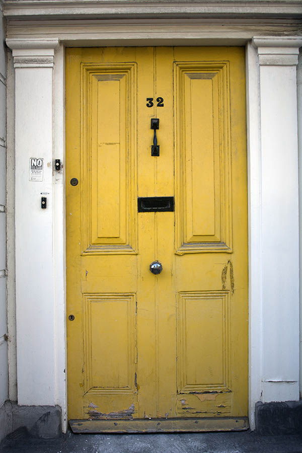 Photo 05287: Worn, panelled, yellow door
