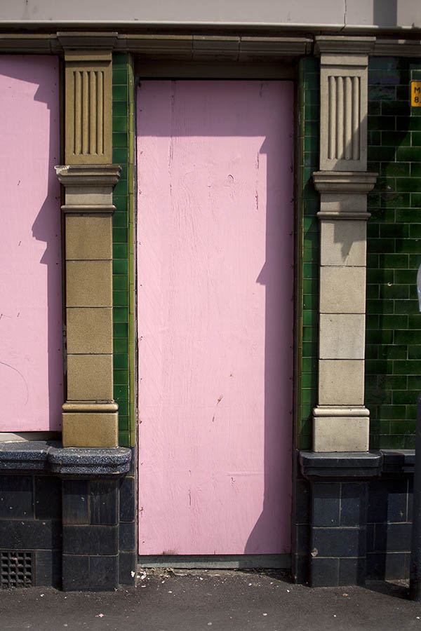 Photo 05846: No door. Former door covered with pink plywood.