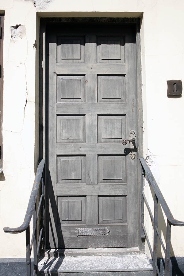 Photo 06051: Panelled, grey door with banisters