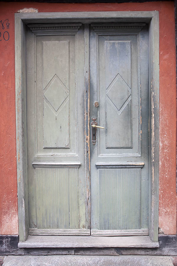 Photo 07384: Worn, panelled, carved, teal double door