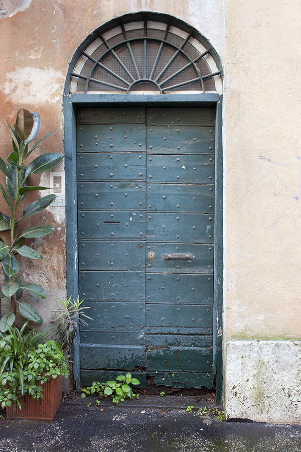 Photo 07969: Worn, teal double door made of planks with latticed fan light