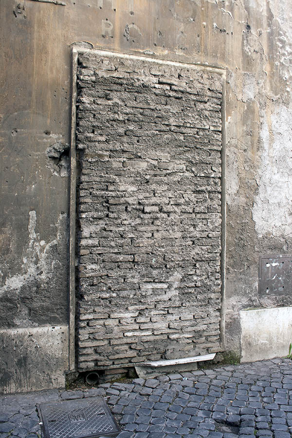 Photo 08086: No door. Former door covered with grey brickwork.