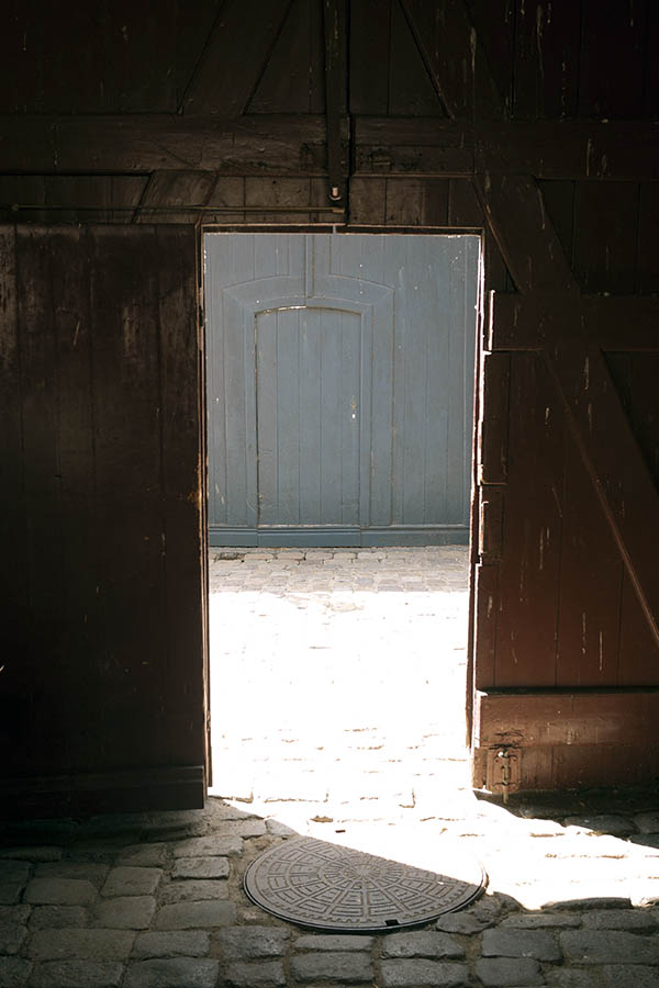 Photo 08628: Open gate seen from the inside with a teal gate in the background