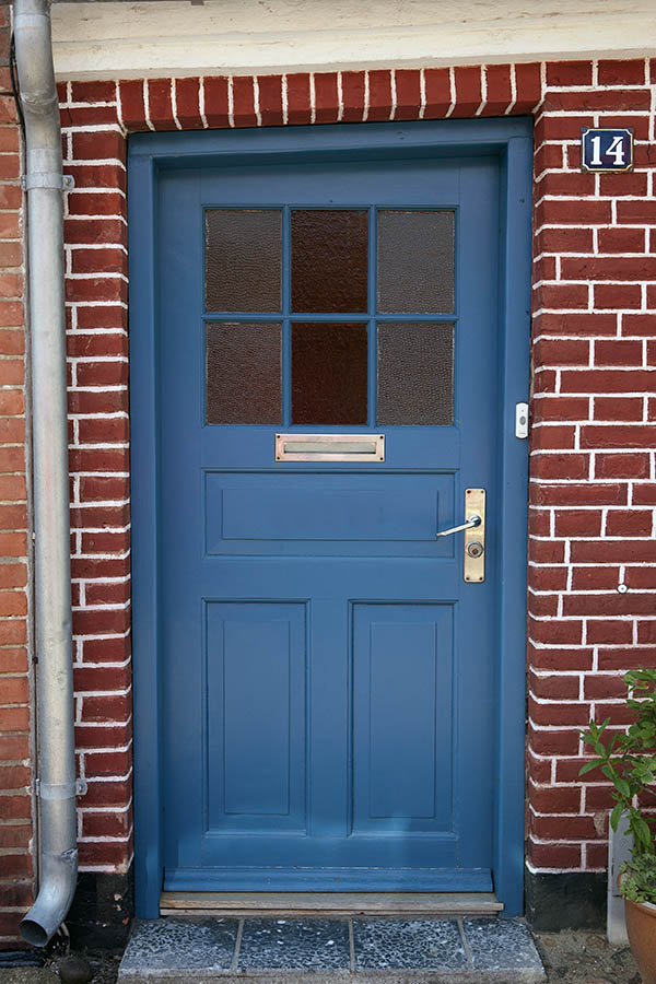 Photo 08645: Lopsided, panelled, blue door with door light