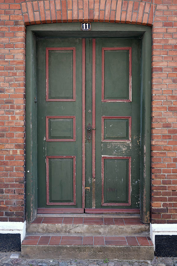 Photo 08707: Decayed, panelled, green and red double door