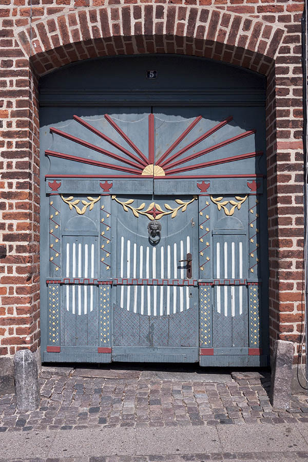 Photo 08713: Carved, black, blue, red, yellow and white gate with minor door