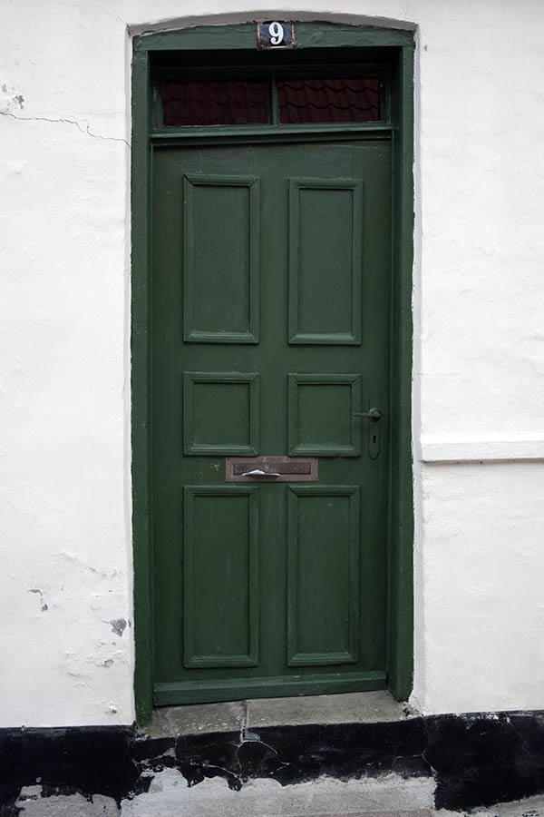 Photo 08843: Worn, lopsided, panelled, green door with top window