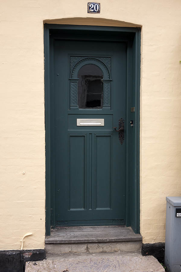 Photo 08919: Carved, panelled, teal door with formed door light