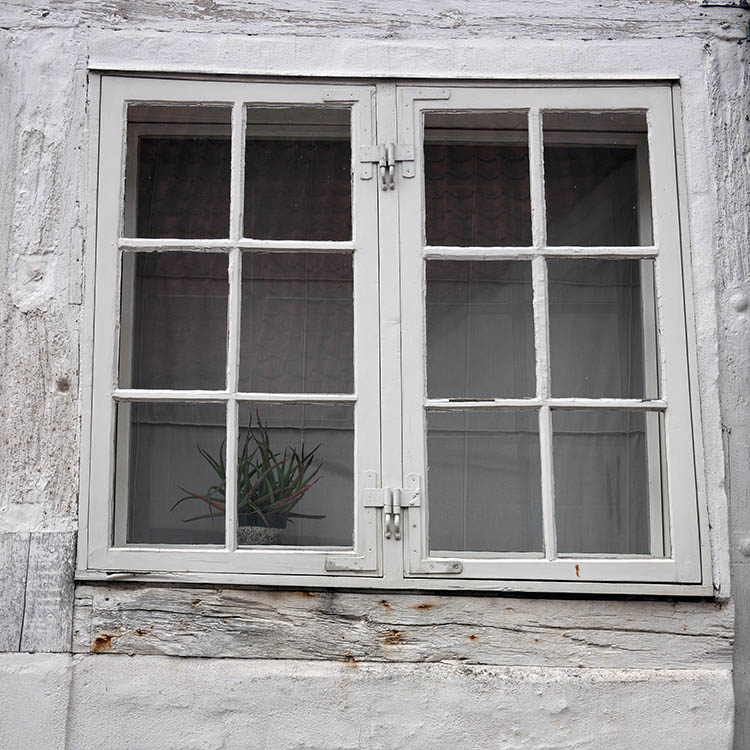 Photo 08929: Lopsided, grey window with two frames and 12 panes