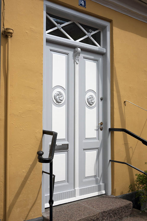 Photo 09197: Carved, panelled, grey and white double door with top window