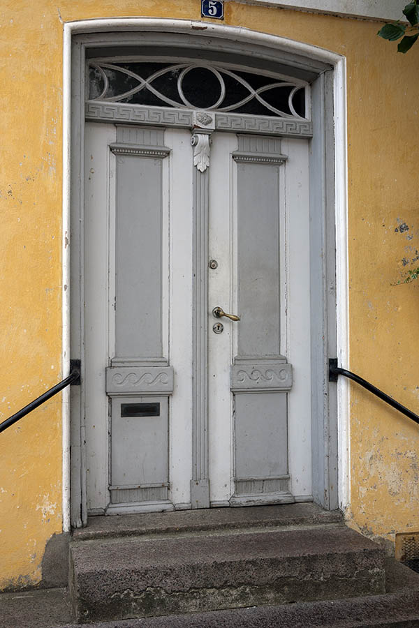 Photo 09202: Carved, panelled, grey and white double door with top window