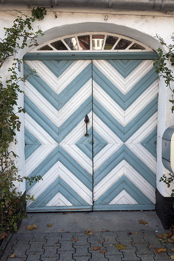 Photo 09309: Worn, white and light blue double door with diamond-shaped boards and fan light