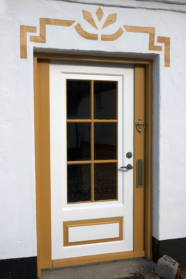 Photo 09345: Panelled, yellow and white door with door light