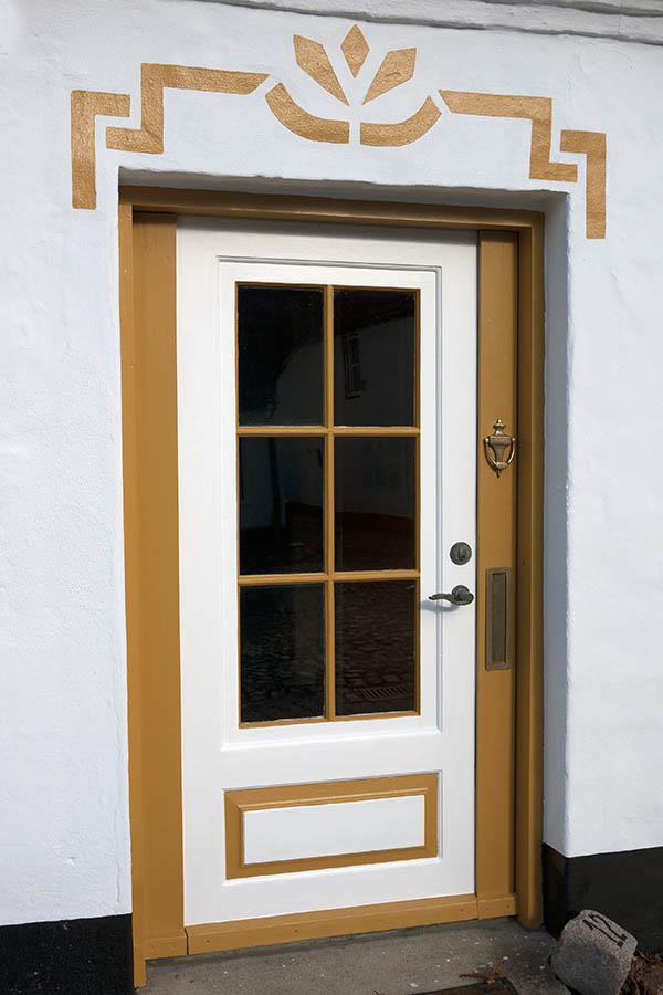 Photo 09345: Panelled, yellow and white door with door light
