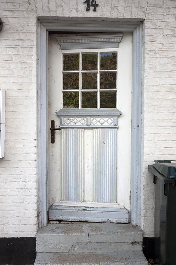 Photo 09359: Carved, panelled, grey and white door with door light