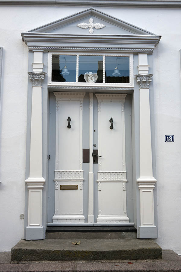 Photo 09384: Carved, panelled, grey and white door with top window