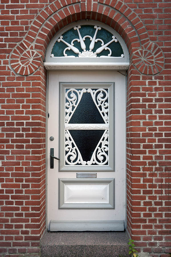 Photo 09414: Carved, panelled, grey, light grey, and white door with fan light and door light