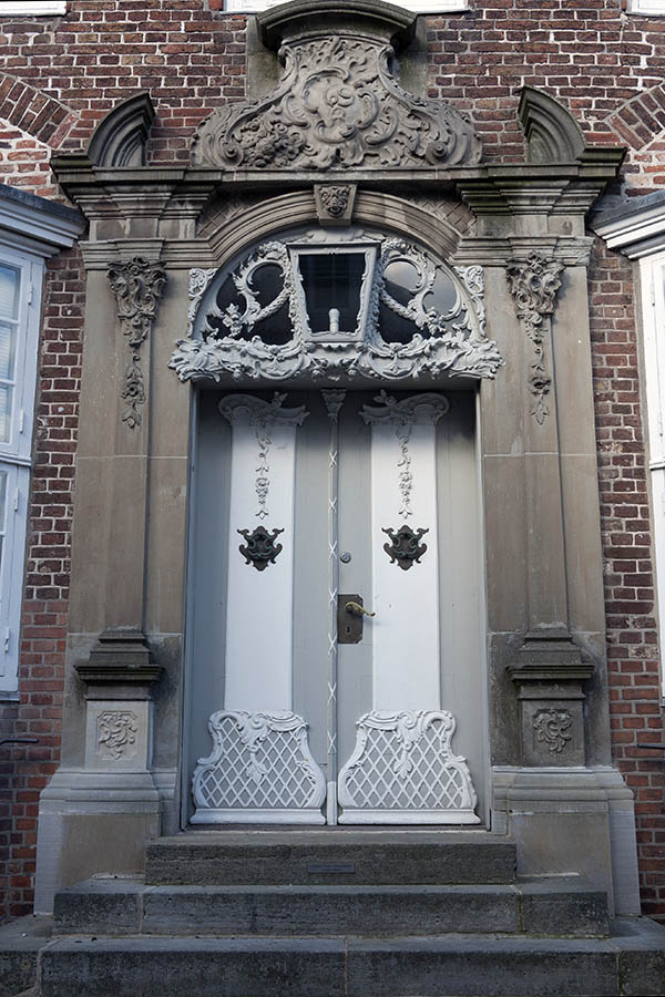 Photo 09456: Lavishly decorated, carved, grey and white double doors with top window 