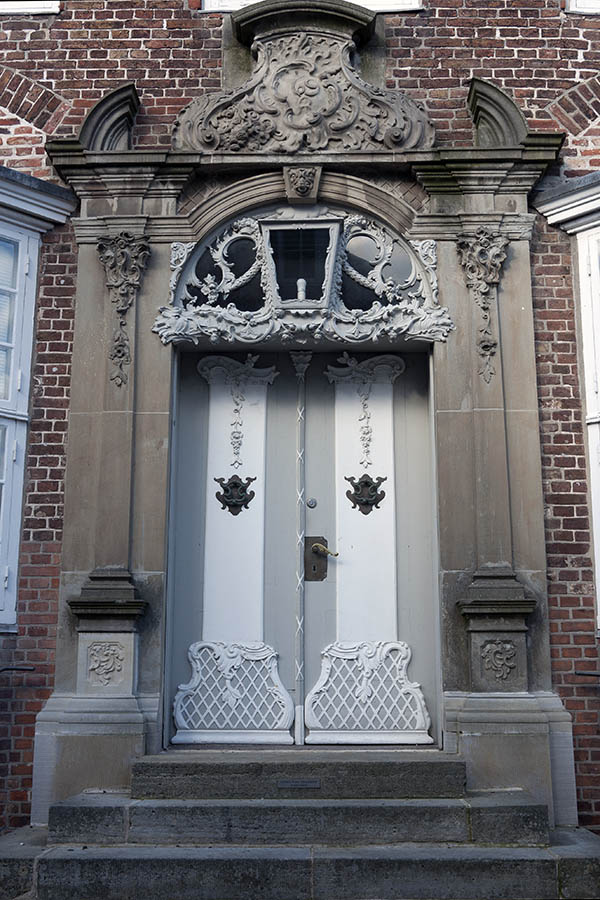 Photo 09456: Lavishly decorated, carved, grey and white double doors with top window 