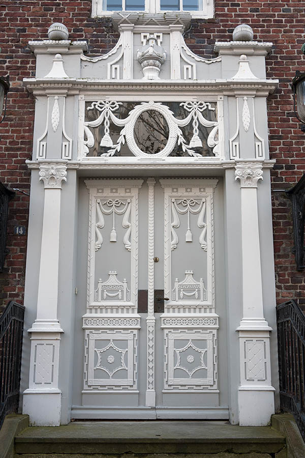 Photo 09463: Lavishly decorated, carved, grey and white double doors with top window 