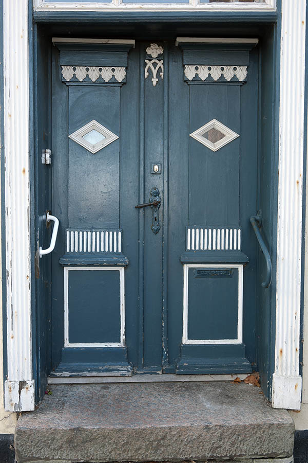 Photo 09486: Carved, panelled, teal and white double door with small door lights