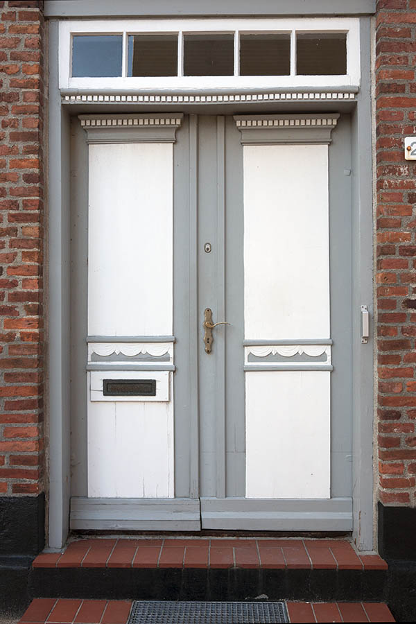 Photo 09556: Carved, panelled, grey and white double door with top window