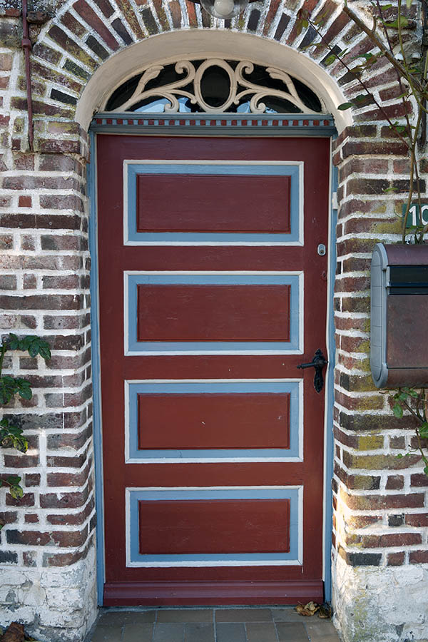 Photo 09619: Carved, panelled, red, light blue and white double door with fan light