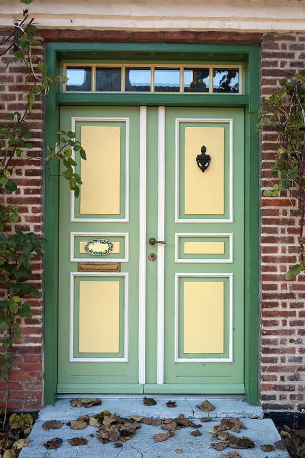 Photo 09638: Panelled, green, light green, light yellow and white double door with top window