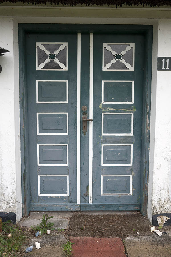 Photo 09684: Worn, panelled, teal and white double door with door lights