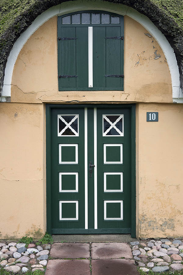 Photo 09699: Worn, panelled, green and white double door with door lights