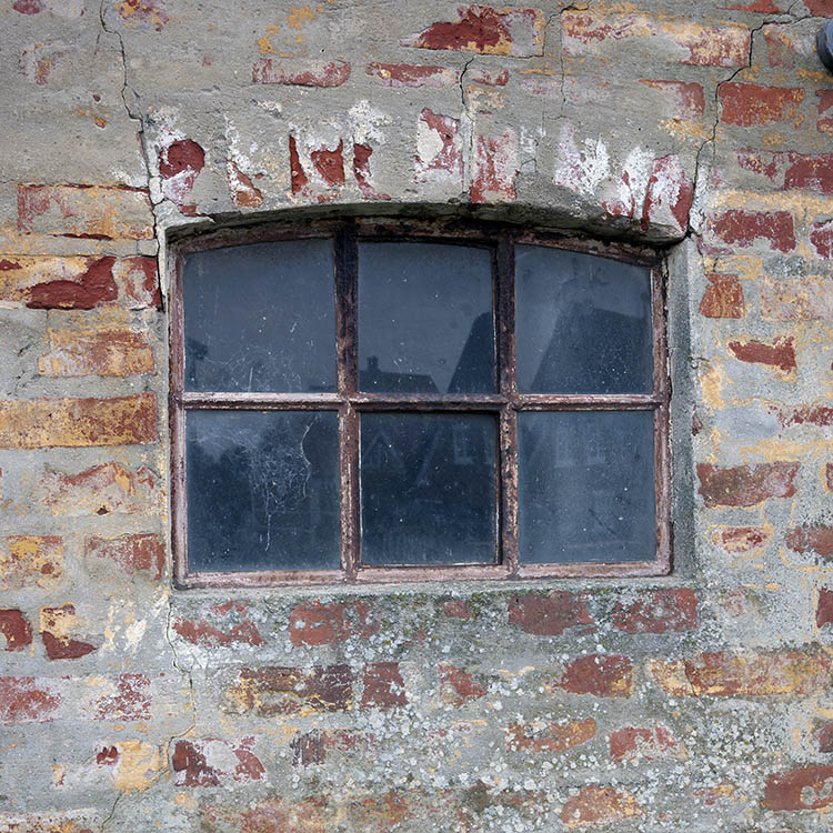 Photo 09714: Formed, rusty, brown metal stable window