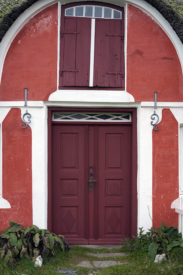 Photo 09830: Carved, panelled, red and white double door with top window