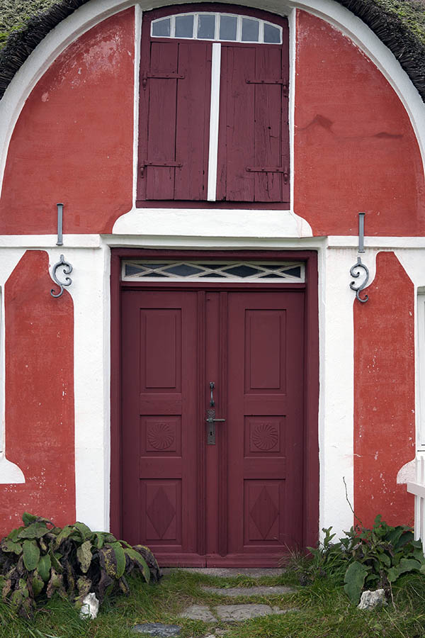 Photo 09830: Carved, panelled, red and white double door with top window