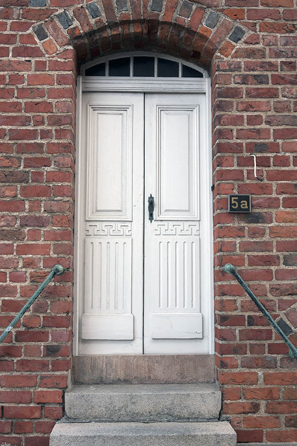 Photo 10047: Carved, panelled, white double door with fan light