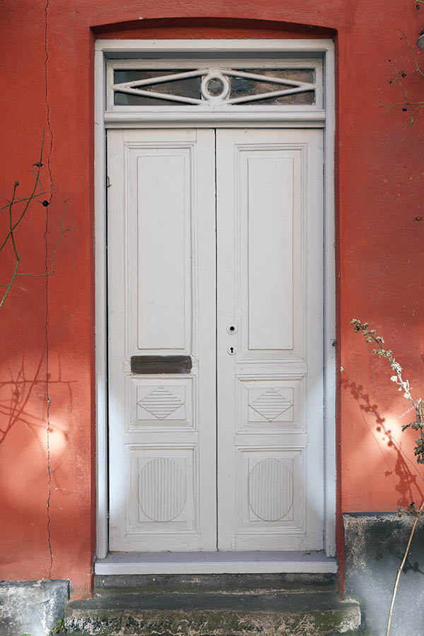 Photo 10097: Carved, panelled, white double door with top window