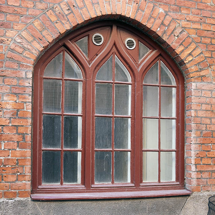 Photo 10122: Formed, brown window with three frames and 12 panes