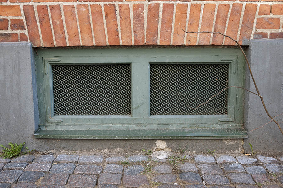 Photo 10236: Latticed, teal window with two panes