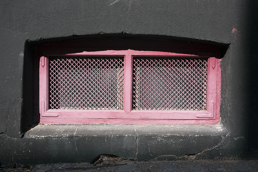 Photo 10324: Pink cellar window with lattice